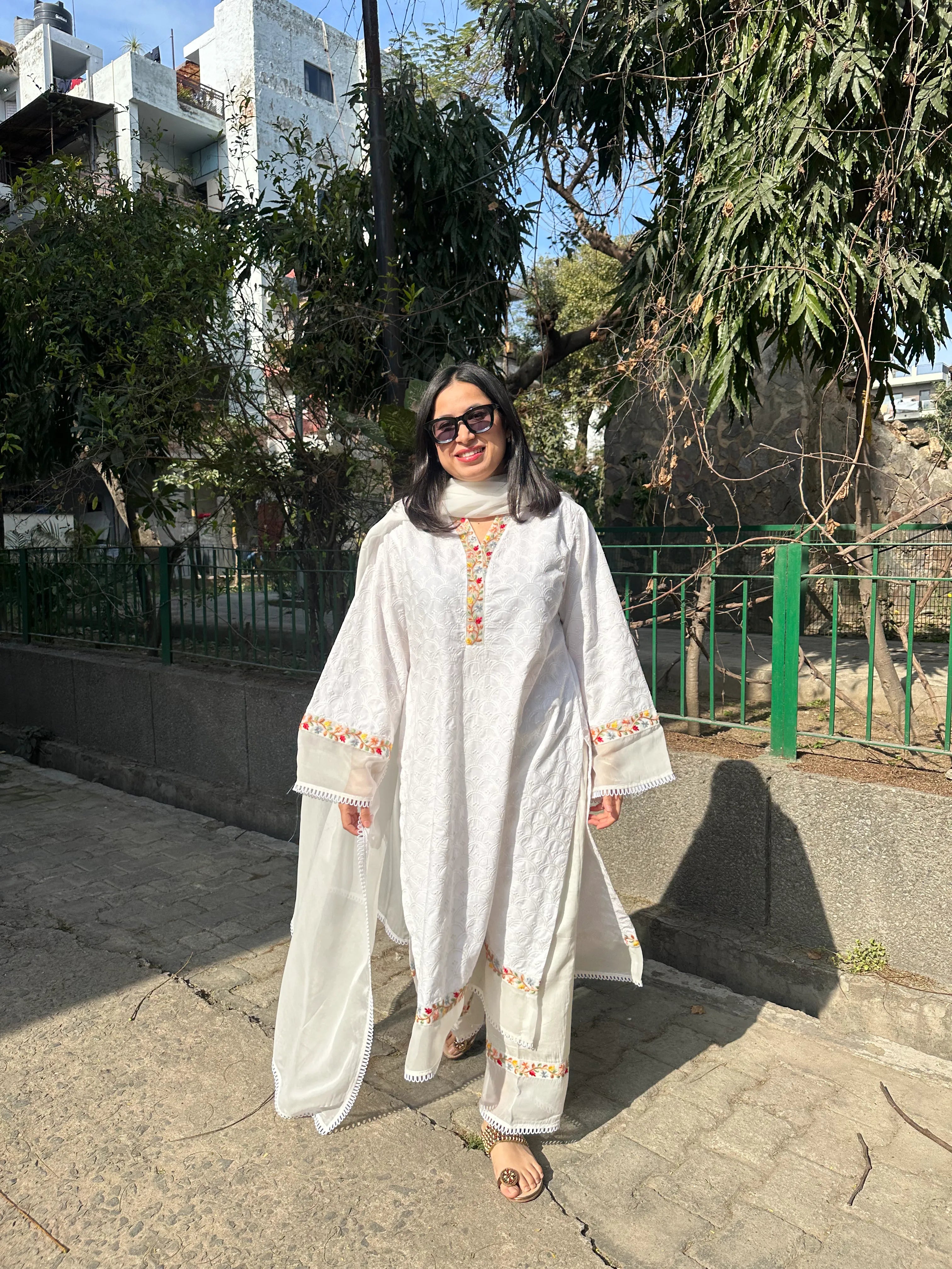 Afreen White Embroidered Kurta Set Long by Pyoor featuring straight pants and beautiful embroidery.