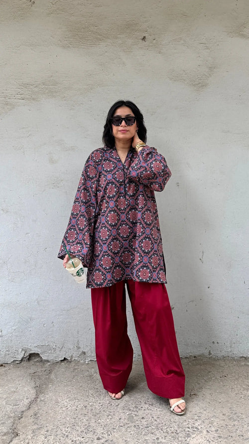 Pyoor Ajrak Farshi Salwar Suit Set featuring traditional Ajrak print and contrast red salwar.