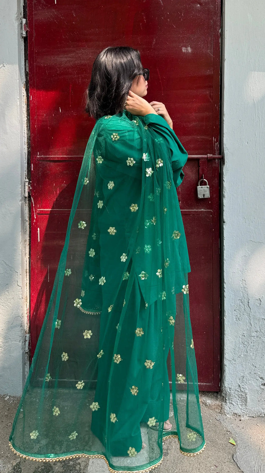 Green suit from Pyoor’s Solids Emerald Farshi Suit Set, perfect for festive celebrations.