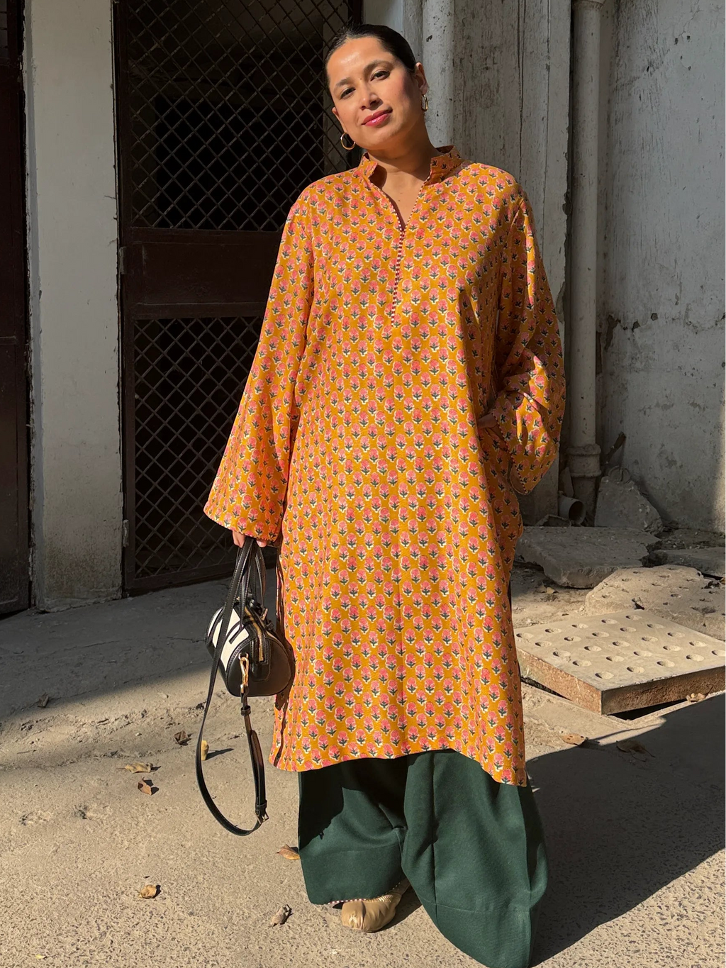 Pyoor Marigold Winter Pashmina Farshi Set showcasing lace sleeves and green salwar