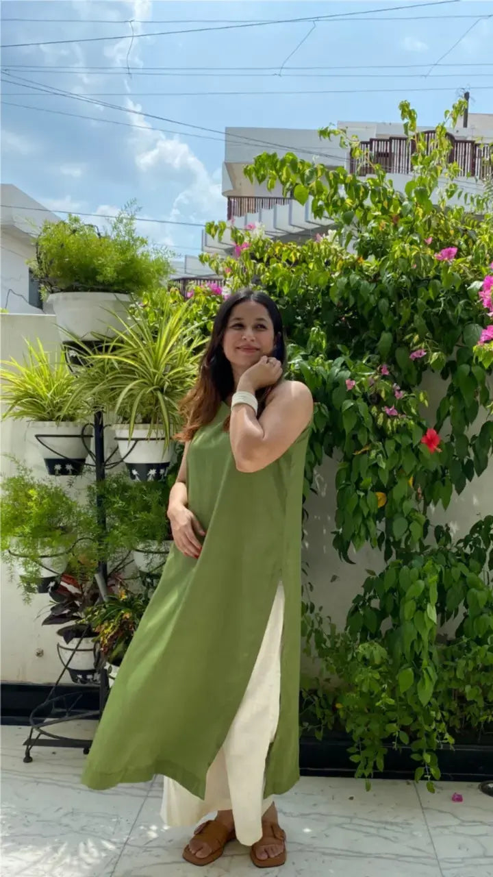 Neem Co-ord Set in Middle Eastern Fit by Pyoor in green with sleeveless kurta and flared pants