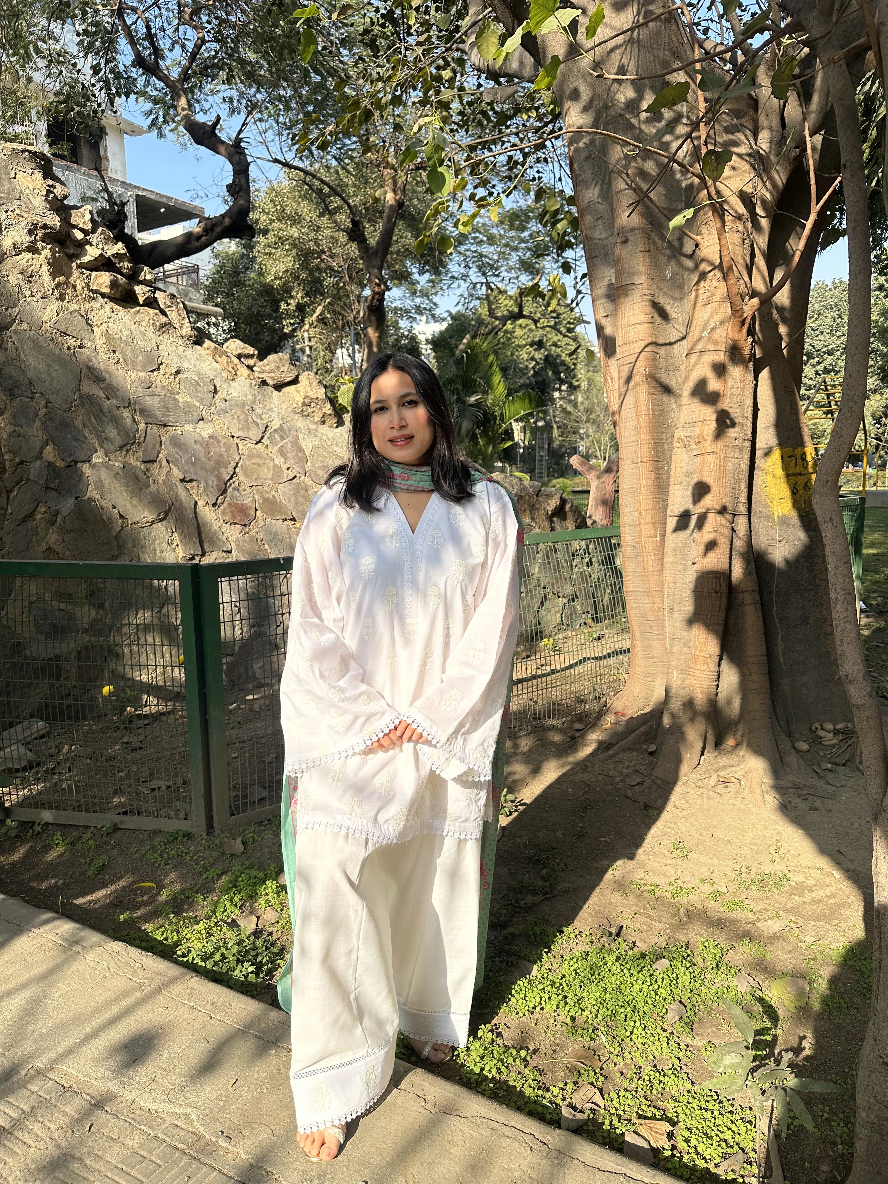 Parizaad Embroidered White Set by Pyoor styled in relaxed cotton kurta salwar set