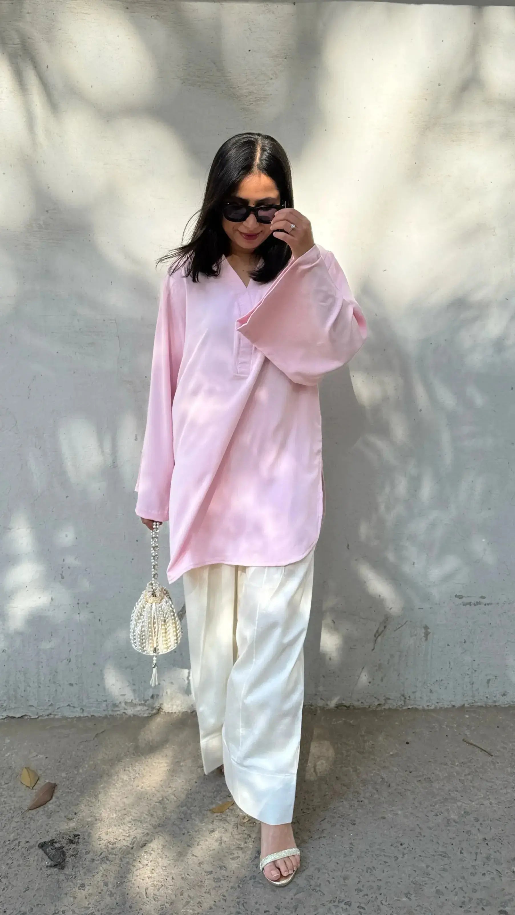 Pyoor SOLIDS Baby Pink Farshi Salwar Suit Set featuring breathable fabric and oversized sleeves.