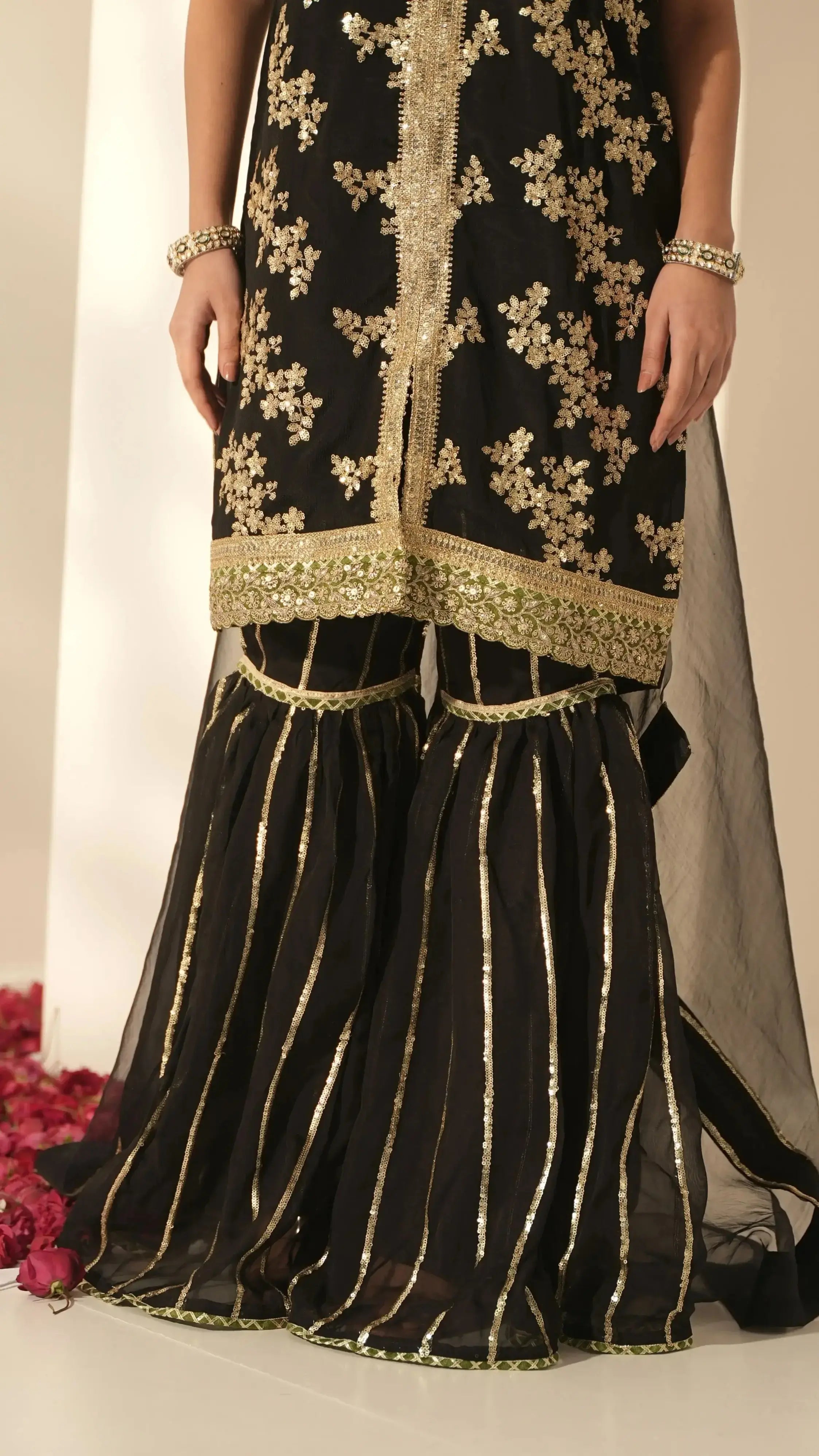 Elegant Sitara black sharara suit by Pyoor with golden lace detailing and Chinon fabric.