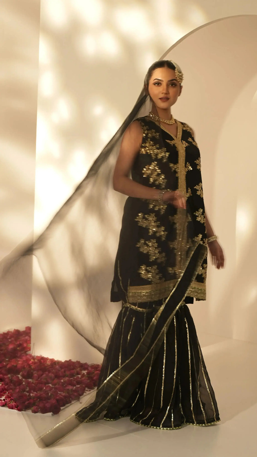 Pyoor’s Sitara black sharara suit crafted in Chinon with refined embroidery and festive charm.