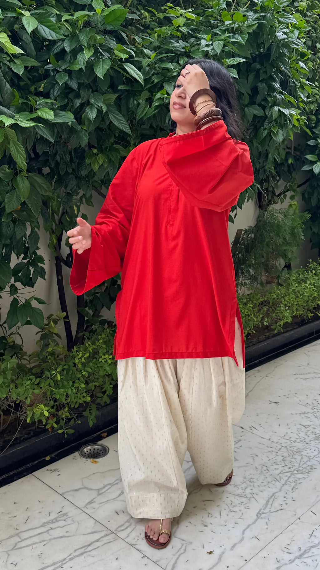 Pyoor Solids Orange Farshi Set featuring bright cotton kurta and golden embroidered salwar.