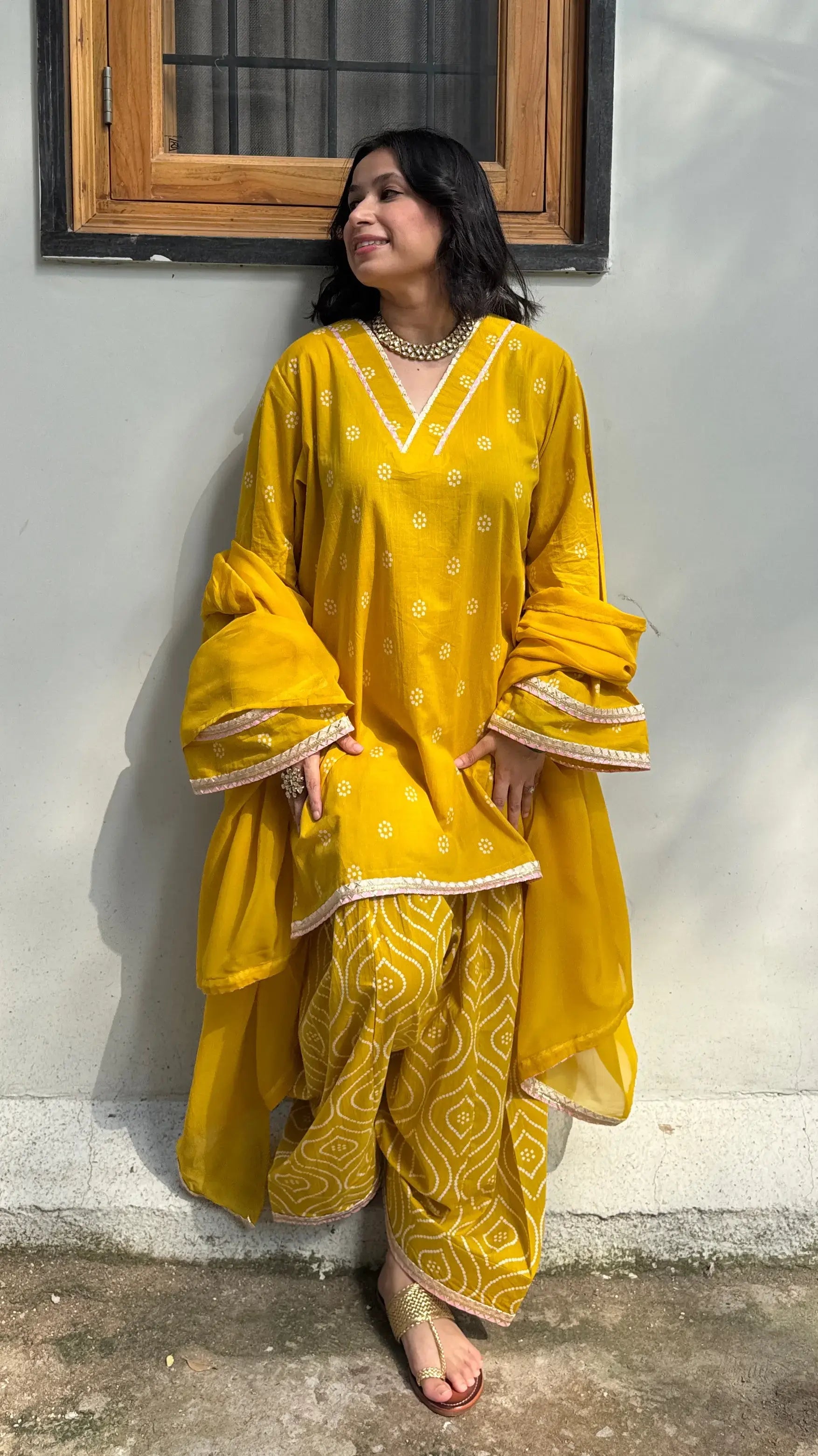 Yellow Bandhani Farshi Salwar Suit Set by Pyoor featuring organza dupatta and lace details