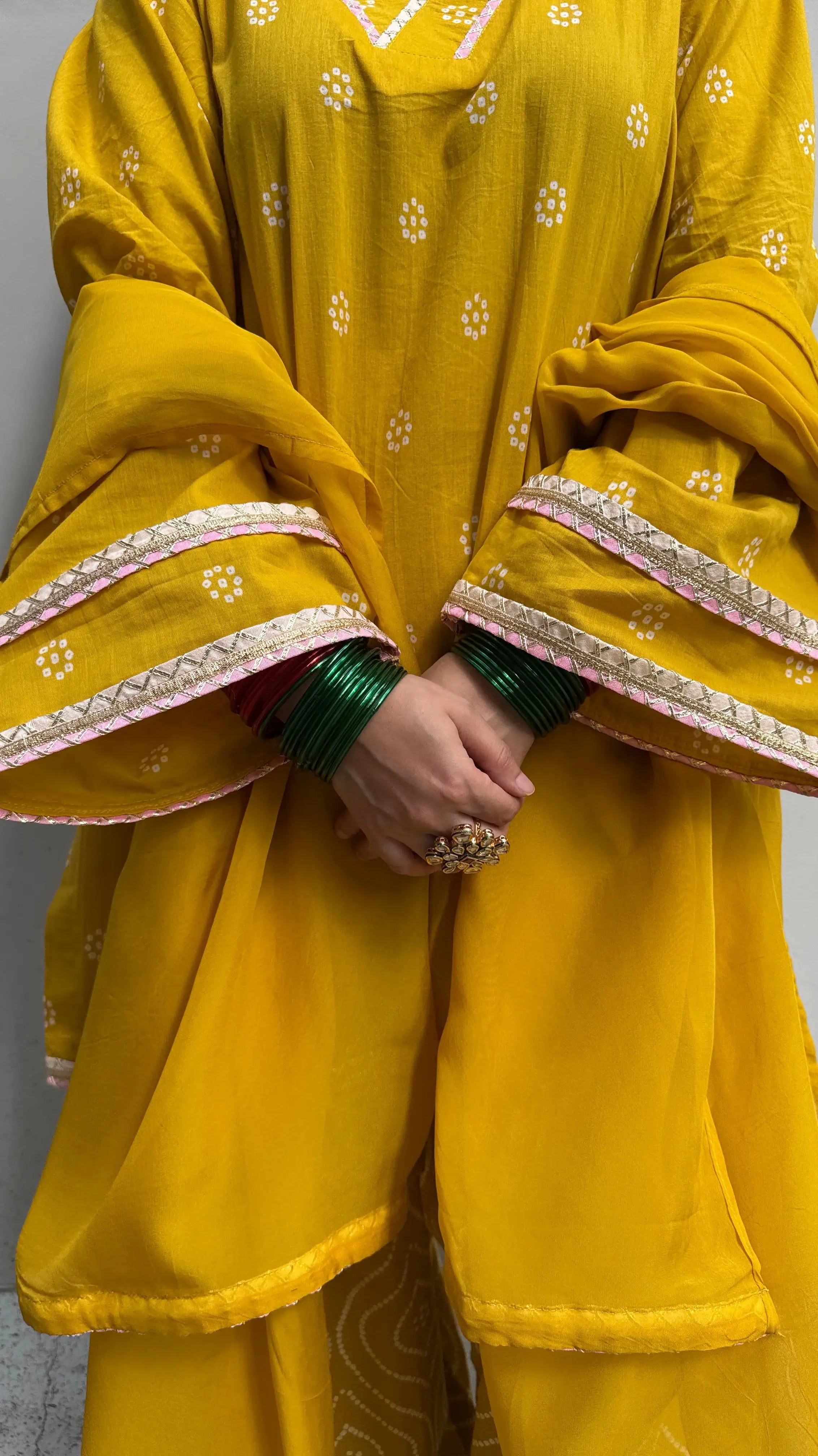 Pyoor Yellow Bandhani Farshi Salwar Suit Set with festive design and relaxed loose fit